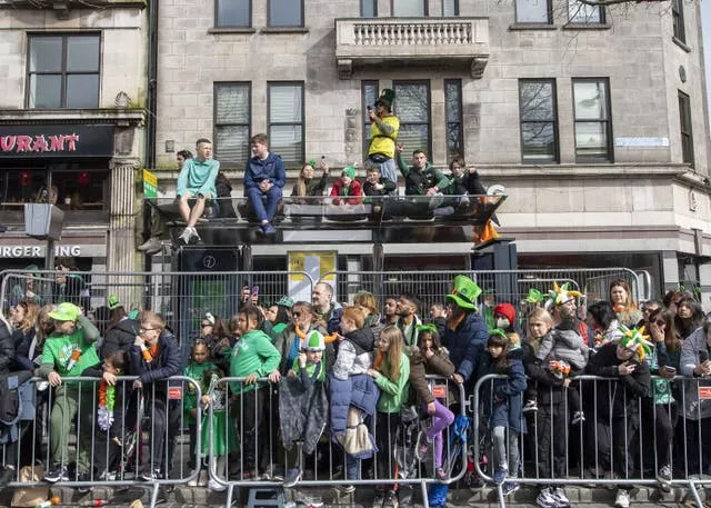 The crowd watch performers during the St Patrick’s Day Parade in Dublin