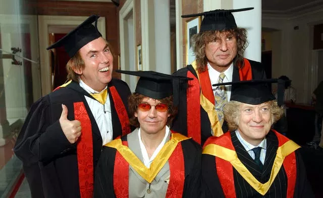 Former members of ‘Slade, from left, Noddy Holder, Dave Hill, Jim Lea and Don Powell, collect honorary followships from the University of Wolverhampton in 2002 