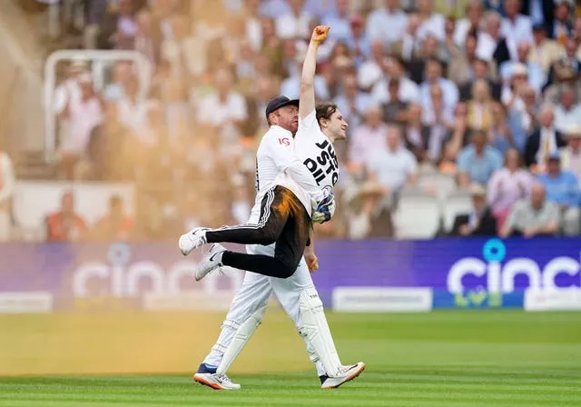 Jonny Bairstow carries Just Stop Oil protester off pitch