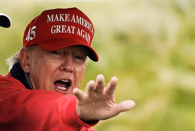Donald Trump wearing a 'Make American great again hat'