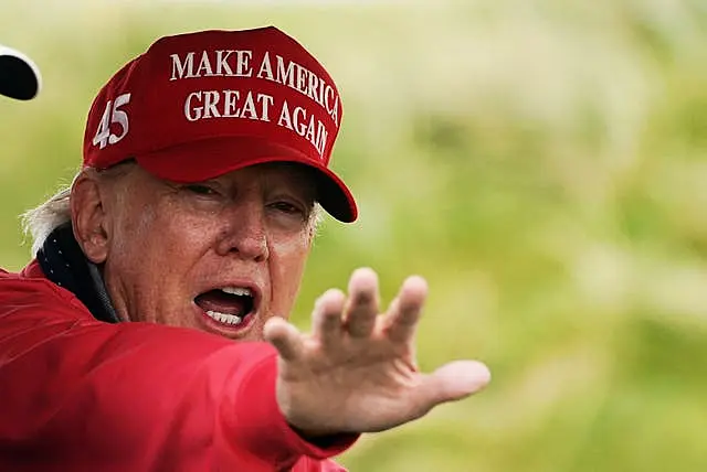 Donald Trump wearing a 'Make American great again hat'