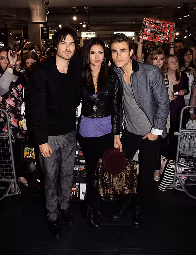 Ian Somerhalder Nina Dobrev and Paul Wesley pictured in front of a large crowd of fans