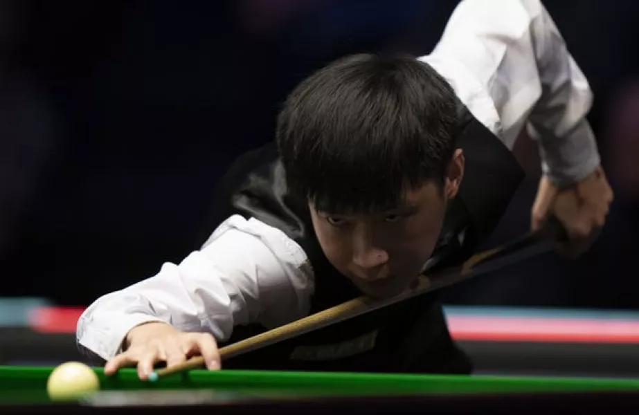 Zhao Xintong is through to the last 16