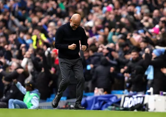 Manchester City manager Pep Guardiola celebrates the opening goal scored by Erling Haaland