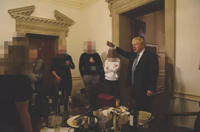 The then-prime minister Boris Johnson (right) at a leaving gathering in the vestibule of the Press Office of 10 Downing Street in November 2020 