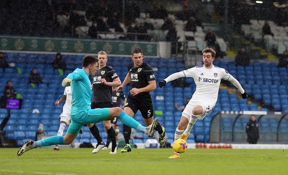 Burnley keeper Nick Pope concedes a penalty for a challenge on Leeds striker Patrick Bamford