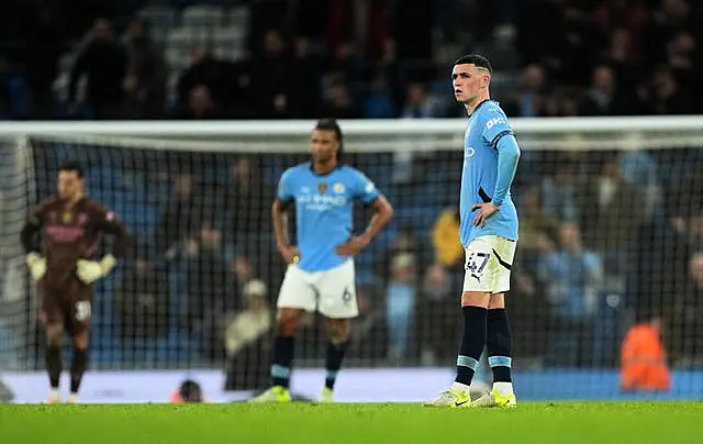 Manchester City’s Phil Foden appears dejected after Tottenham score their fourth goal during their 4-0 win at the Etihad Stadium