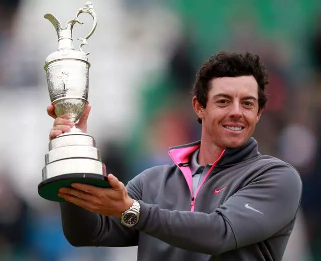 McIlroy celebrates with the Claret Jug after winning the 2014 Open Championship at Royal Liverpool Golf Club