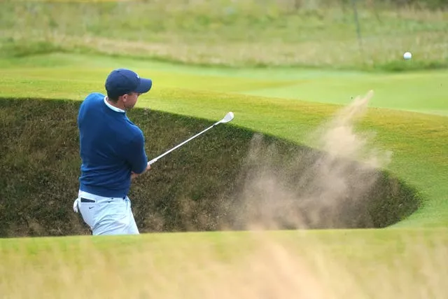 Rory McIlroy plays out of a bunker at Royal Troon