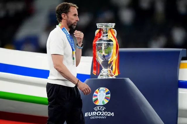 England boss Gareth Southgate walks past the Euro 2024 trophy after defeat to Spain in the final