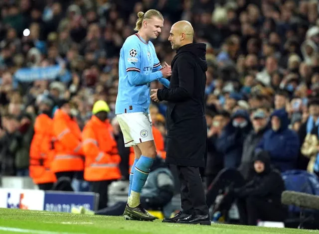 Pep Guardiola, right, will check on Erling Haaland 