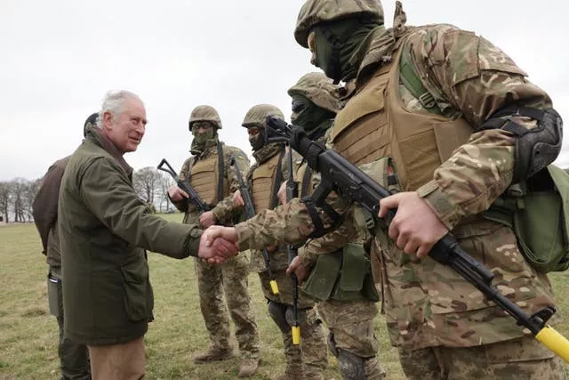 The King meets Ukrainian recruits during a visit to a training site for Ukrainian military recruits in Wiltshire