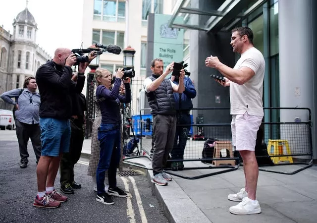 Price's former husband Alex Reid speaks to media outside the Rolls Building