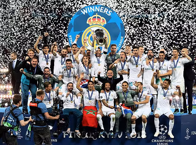 Real Madrid celebrate with the trophy after the 2018 Champions League final