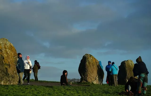 People gather for sunrise at Newgrange on the morning of the winter solstice 