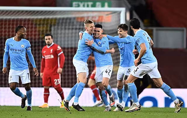 Manchester City celebrate a goal at Anfield