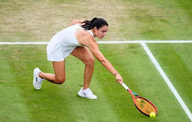 Emma Navarro stretches to hit a backhand