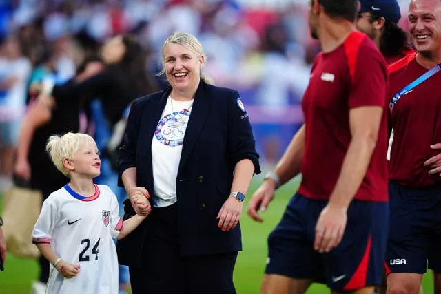 Emma Hayes, holding her son's hand, at the Paris 2024 Olympics 