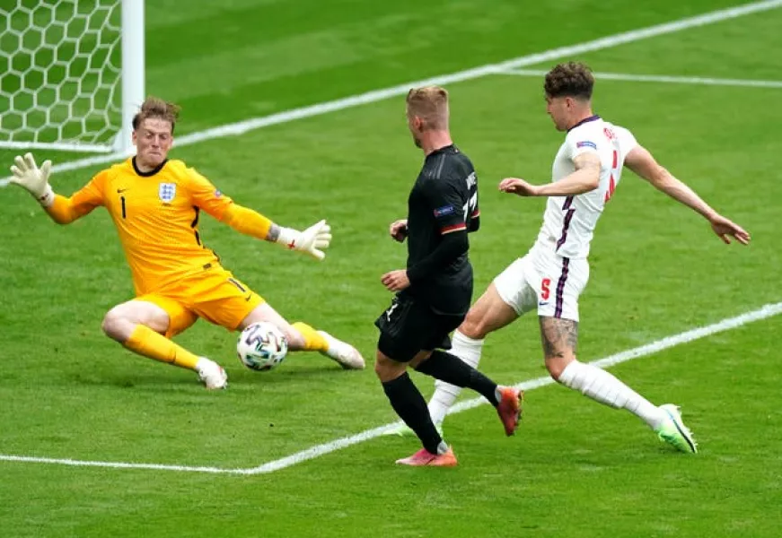 England goalkeeper Jordan Pickford (left) has kept five successive clean sheets at Euro 2020