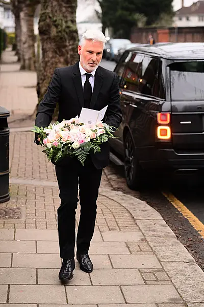 Hair and make-up artist Gary Cockerill arrives at Golders Green Crematorium, north London, for the private funeral service of Dame Barbara Windsor