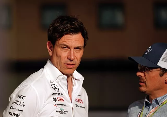 Wolff (left) is confident Hamilton will stay at least for next season 