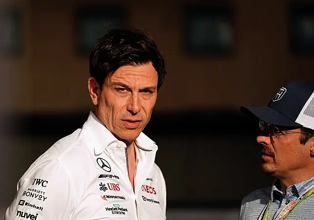 Wolff (left) is confident Hamilton will stay at least for next season