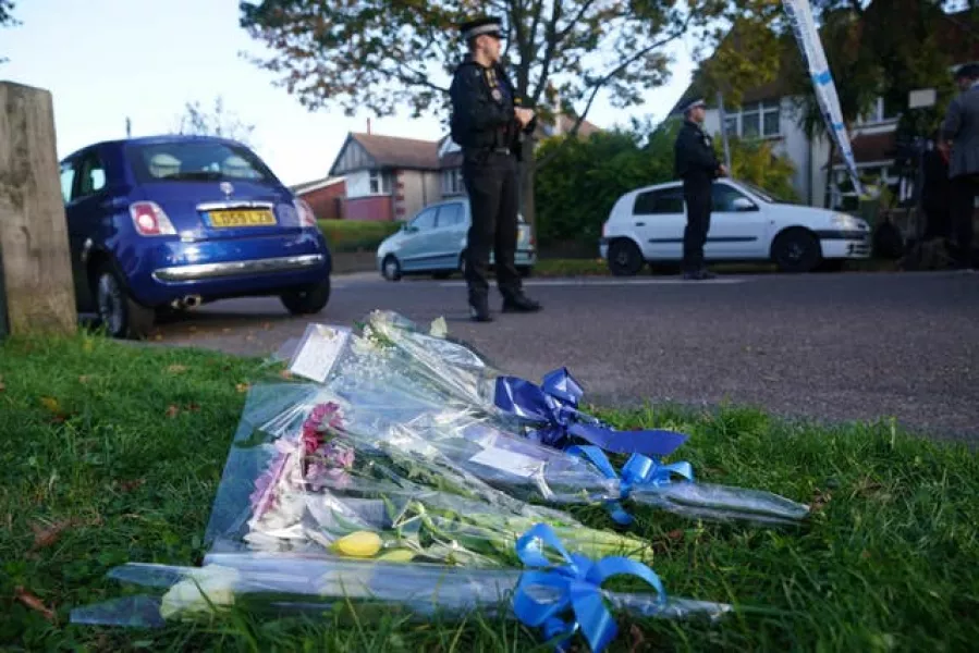 Flowers at the scene near the Belfairs Methodist Church in Eastwood Road North, Leigh-on-Sea, Essex, where Conservative MP Sir David Amess has died after he was stabbed several times at a constituency surgery 