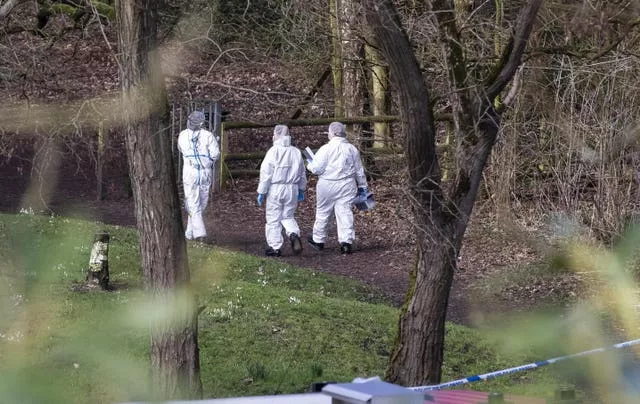 Police forensics officers at the scene of the attack