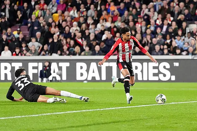 Kevin Schade, right, steadies himself to score Brentford's opener