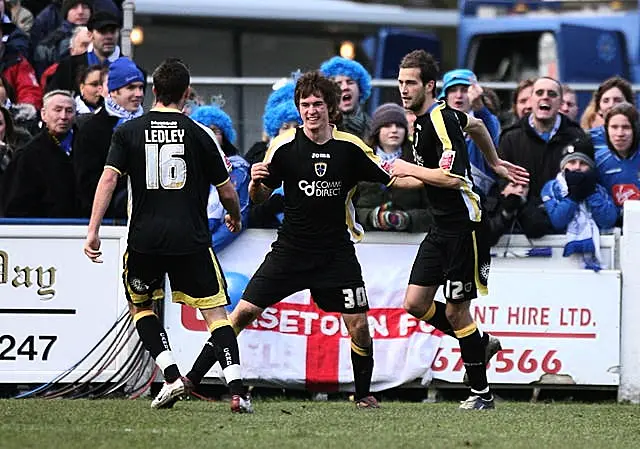 Aaron Ramsey, centre, celebrates an FA Cup goal for Cardiff as an 18-year-old