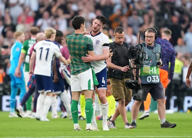 England’s Declan Rice embraces the Republic of Ireland's Callum O'Dowda, left, after the game