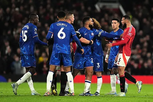 Noussair Mazraoui faces off with Chelsea's players