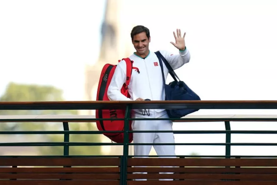 Roger Federer waves at Wimbledon