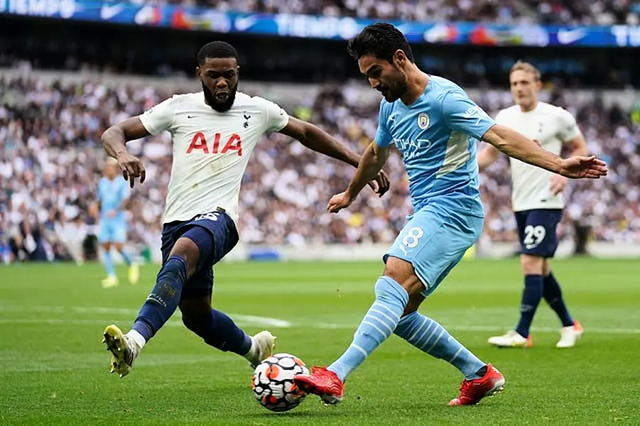 Ilkay Gundogan (right) in action against Tottenham