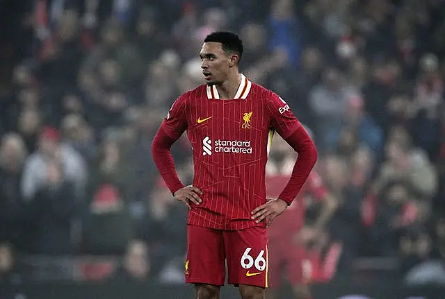 Liverpool's Trent Alexander-Arnold stands with hands on hips