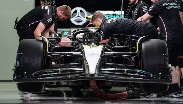Mercedes mechanics prepare Lewis Hamilton's car during preview day of this year's Bahrain Grand Prix