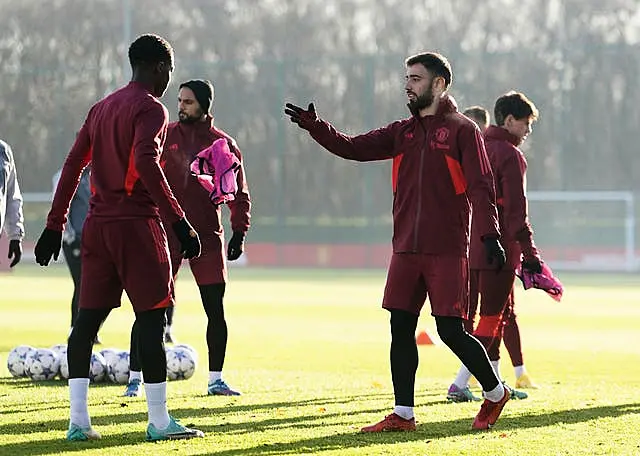 Kobbie Mainoo (left) has learned from Bruno Fernandes at Manchester United