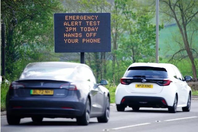 An electronic road sign warns motorists of the impending emergency national alert system warning