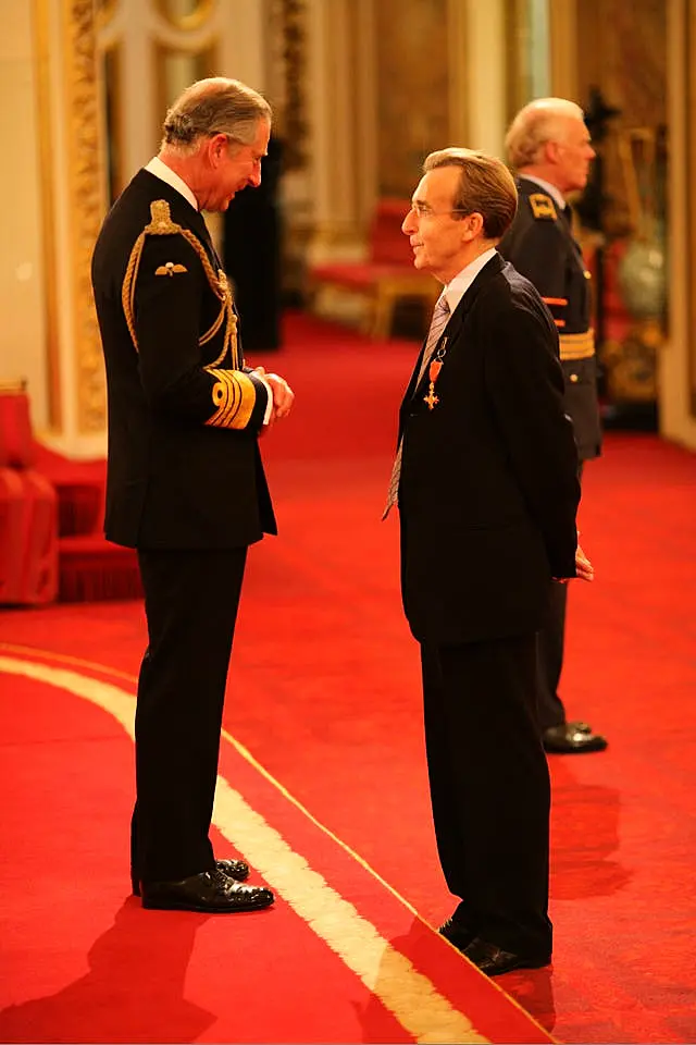 Terry Griffiths is made an OBE by the then-Prince of Wales at Buckingham Palace (Johnny Green/PA)