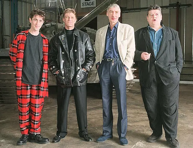 Villains of the new James Bond film Goldeneye line up in front of a tank during a photocall at Leavesden Airfield, Herts, on January 22 1995. L/R, Alan Cumming who is Boris, Sean Bean who plays rouge agent 006, Alec Trevelyan, Gottfried John who is Ourumov and Robbie Coltrane who plays Valentin. Christmas 1995 is the projected world-wide release date for the 40 million thriller