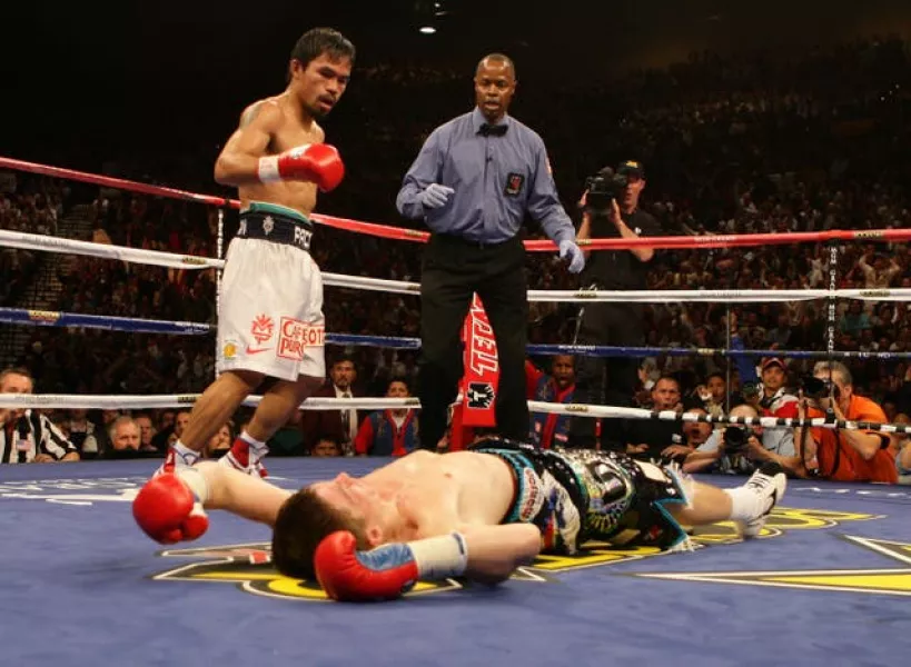 Manny Pacquiao, left, starched Ricky Hatton in their light-welterweight contest (Dave Thompson/PA)