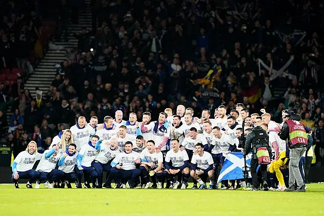 Scotland players celebrate qualifying for Euro 2024 