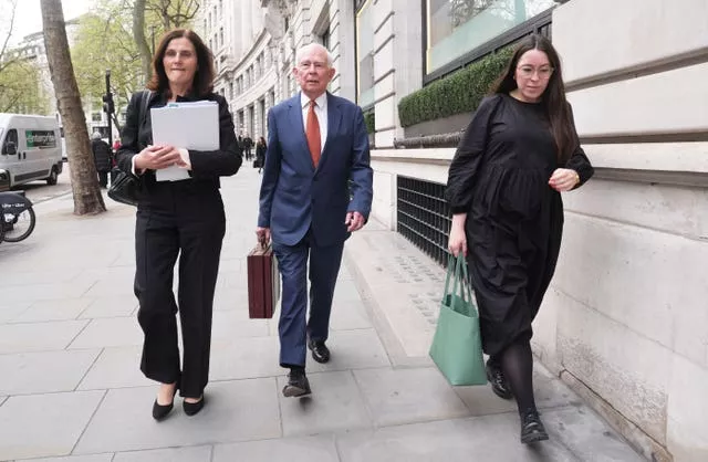 Sir Michael Hodgkinson, centre, leaves after giving evidence to the inquiry at Aldwych House, central London (Lucy North/PA)