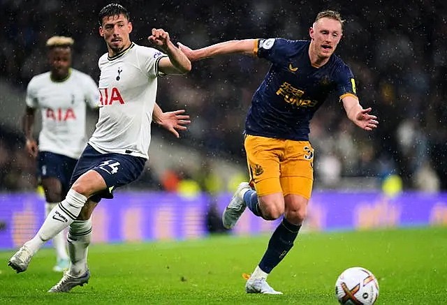 Newcastle’s Sean Longstaff, right, and Tottenham’s Clement Lenglet battle for the ball