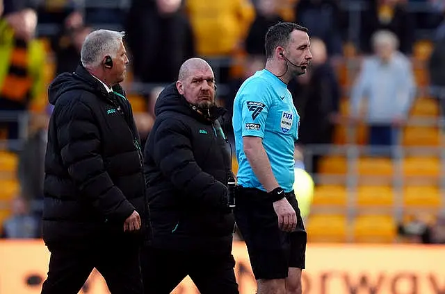 Referee Chris Kavanagh, right, walks off at Molineux