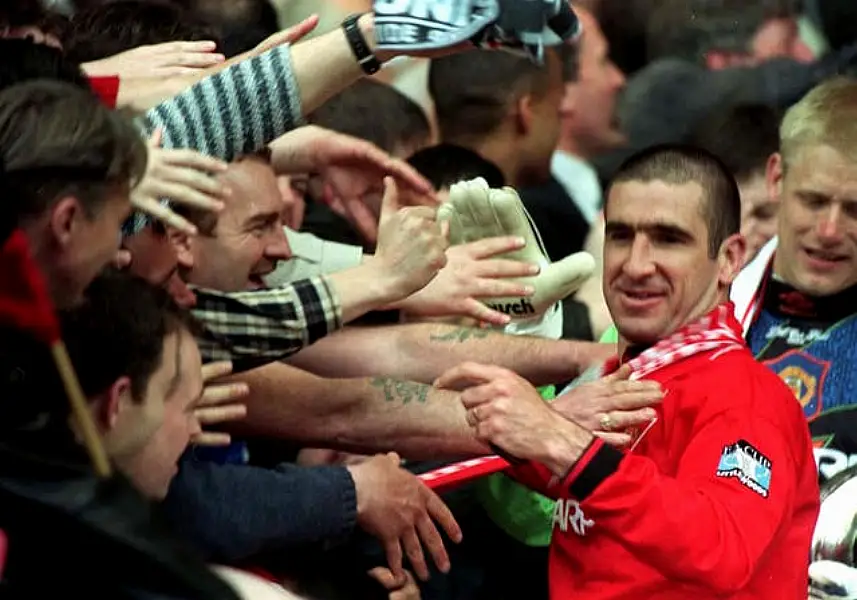 Eric Cantona is greeted by fans after Manchester United's 1996 FA Cup win