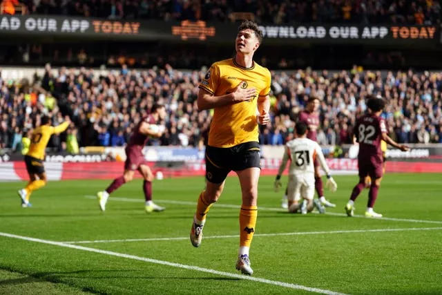 Jorgen Strand Larsen runs off to celebrate netting Wolves' opener against Manchester City