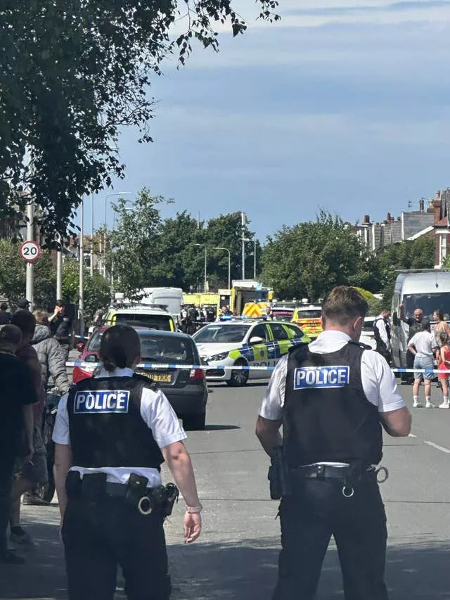 Picture taken with permission posted on the social media site X, formerly Twitter, by @chauffeurWest of emergency services at the scene on Hart Street, Southport, where a man has been detained and a knife has been seized after a number of people were injured in a reported stabbing