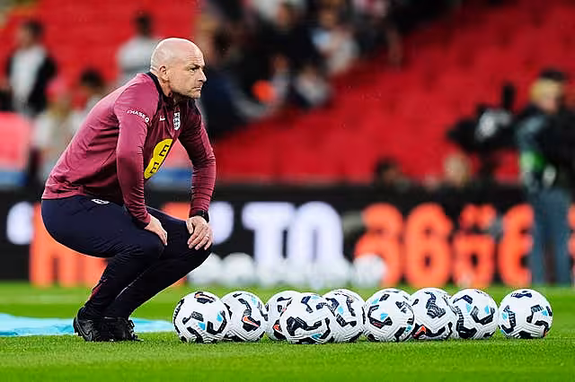England interim manager Lee Carsley watches on during the warm up against Finland