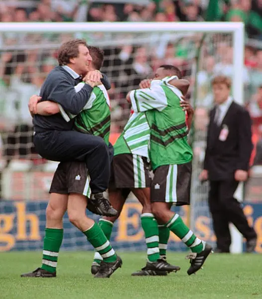 Neil Warnock celebrates with his Plymouth players following their Division Three play-off-final victory over Darlington at Wembley in 1996